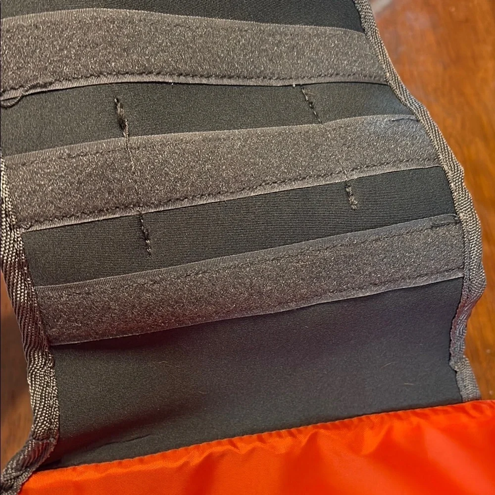 Orange Life Jacket with Black Straps
